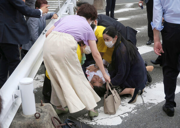 Shinzo Abe, the former prime minister of Japan, lying on the ground in Nara on Friday.