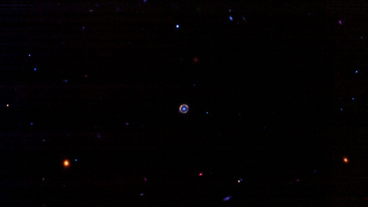 a tiny bright ring against dark space backgrou