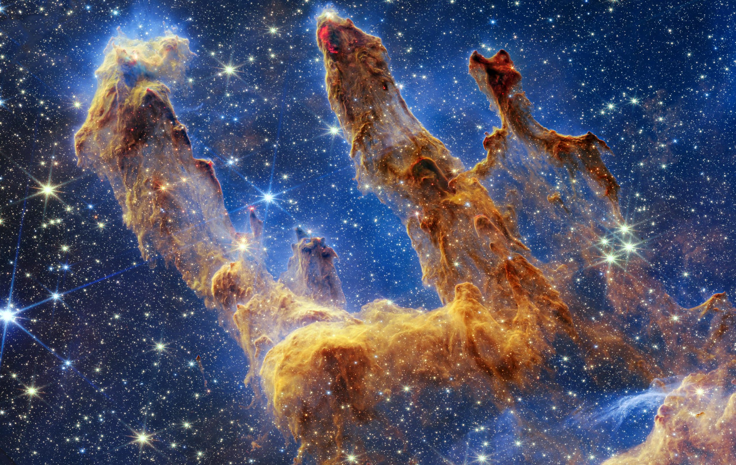 El Telescopio Espacial Webb toma una increíble imagen llena de estrellas de los Pilares de la Creación