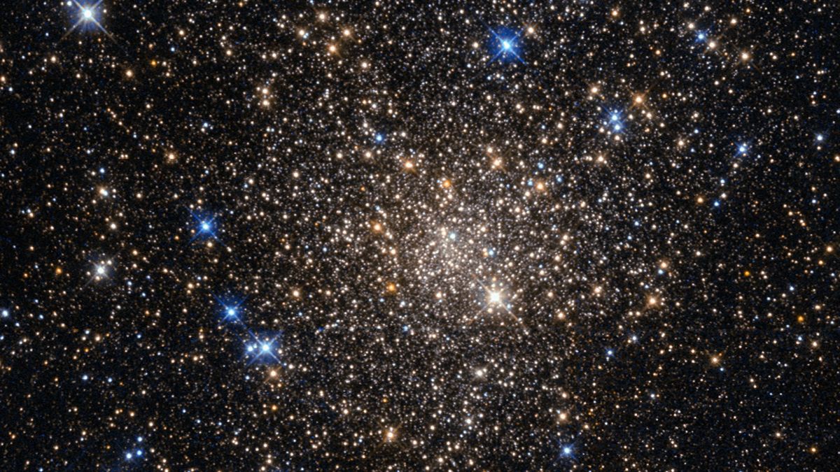 A deep view of space shows thousands of stars glittering in different colors. This image, taken with the Wide Field Planetary Camera 2 on board the NASA/ESA Hubble Space Telescope, shows the globular cluster Terzan 1.