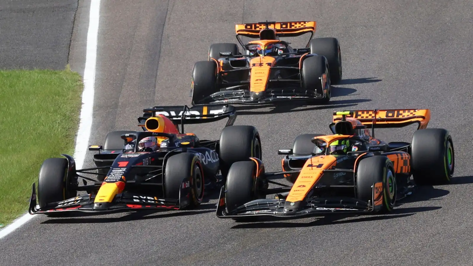 Red Bull and McLaren battle on track.