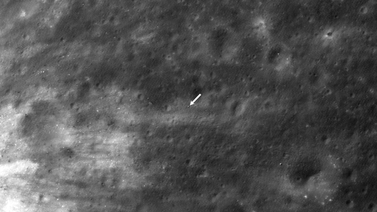 a small white dot on the surface of the moon