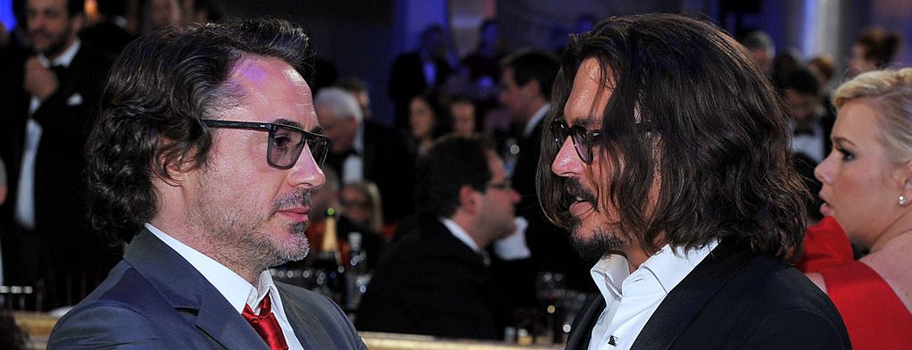 (izq.) Robert Downey Jr. y Johnny Depp en la 68.ª edición de los Golden Globe Awards